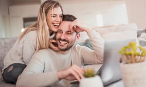 Couple on couch Couple being playful on couch